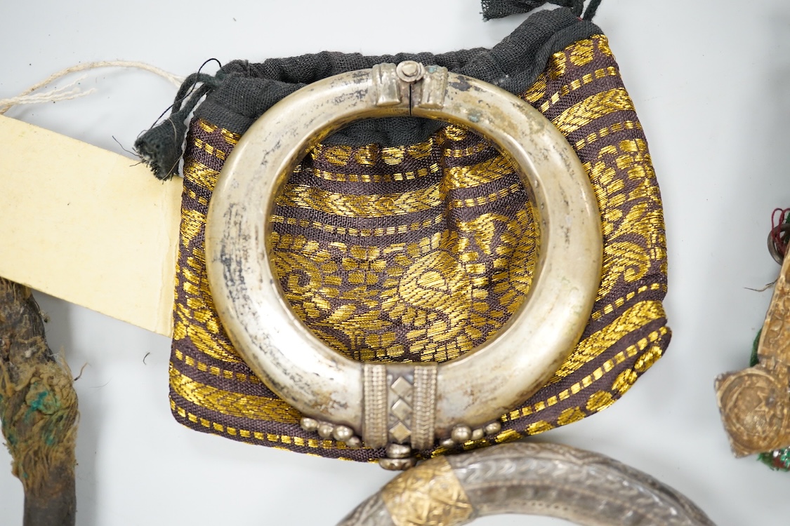 A collection of Bedouin white metal, gilt metal, lapis lazuli mounted jewellery, etc. from Oman